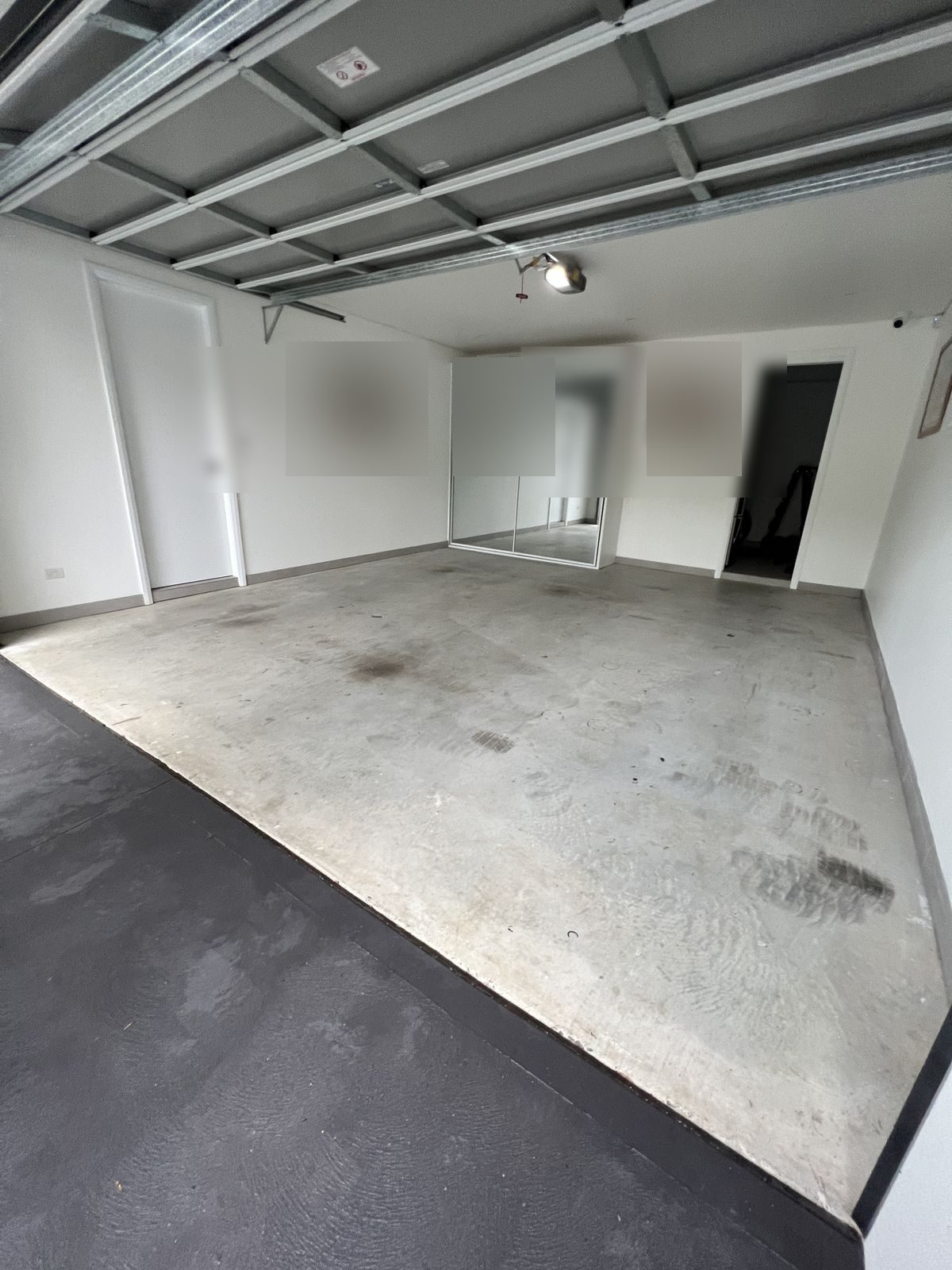 Before. Bare stained concrete garage floor in South West Sydney