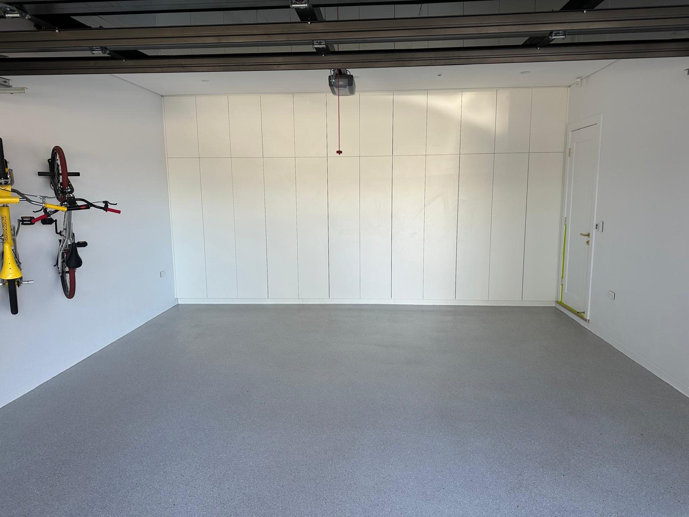 Double car garage with light grey flake epoxy in South West Sydney